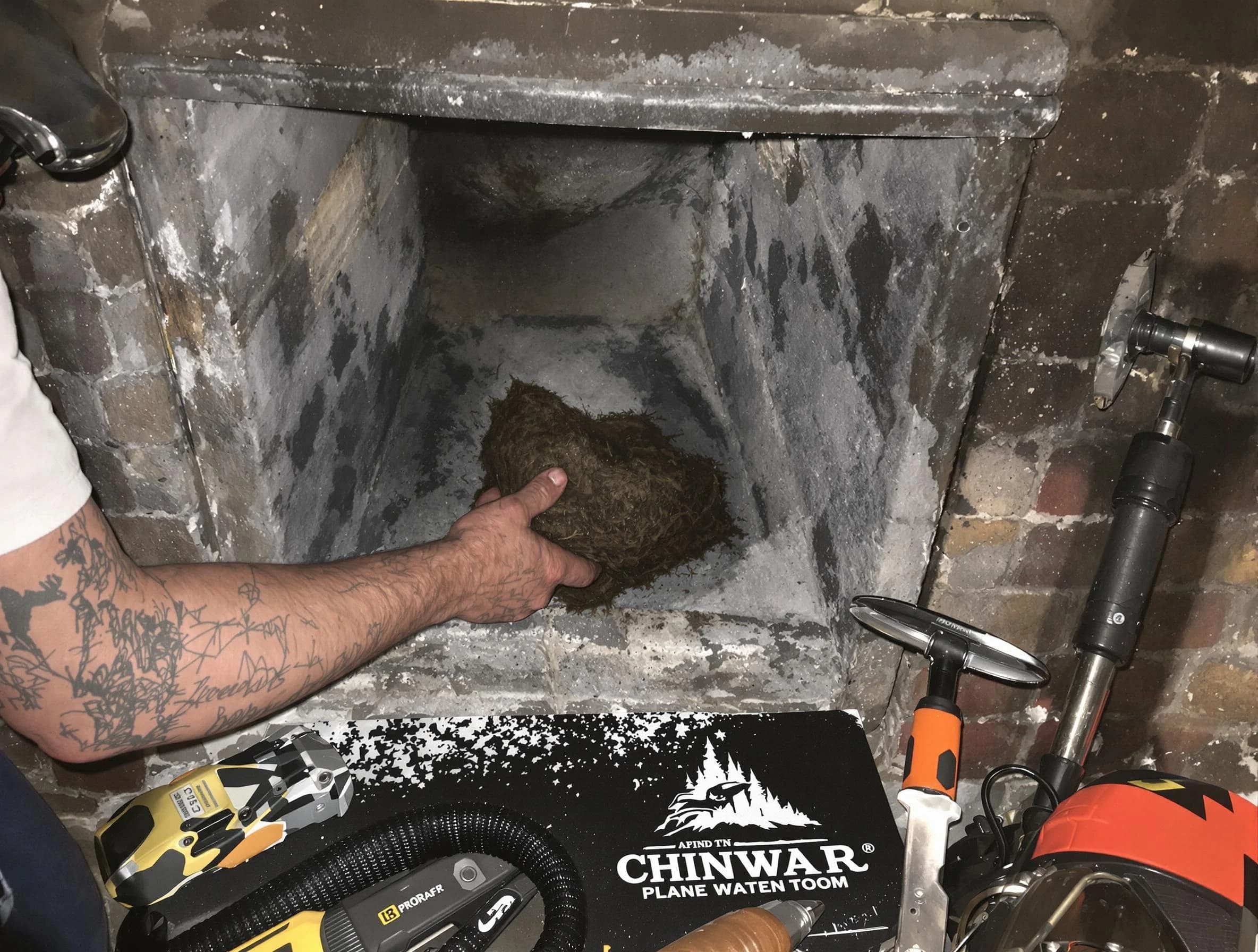 Hueytown Chimney Sweep safely removing debris and screening chimney in Hueytown, AL